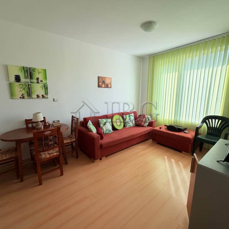 Bright 1-bedroom apartment with large window overlooking Sunny Beach, modern furnishings, and a spac.