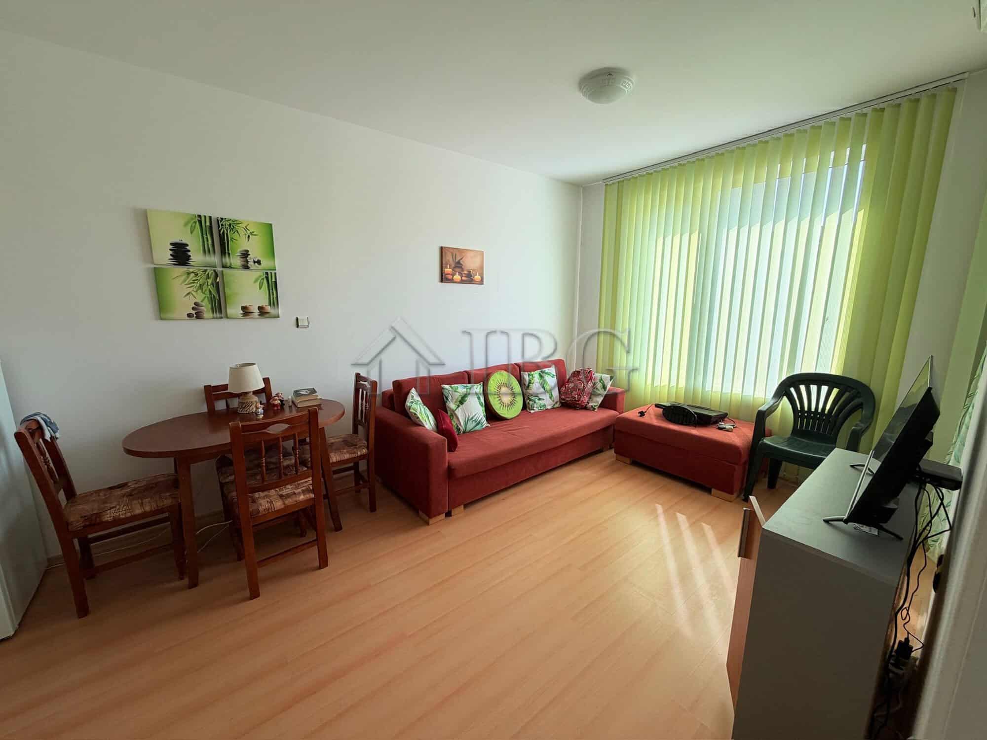 Bright 1-bedroom apartment with large window overlooking Sunny Beach, modern furnishings, and a spac.