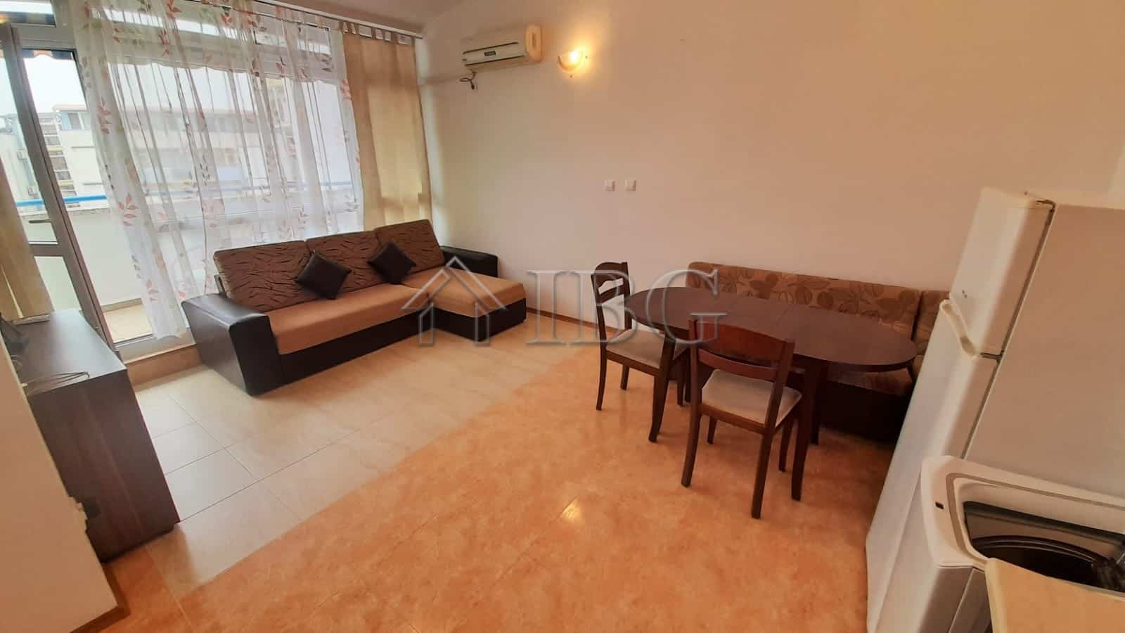 Bright 1-bedroom apartment with pool view, living area, dining space, and balcony in Sunny Beach.