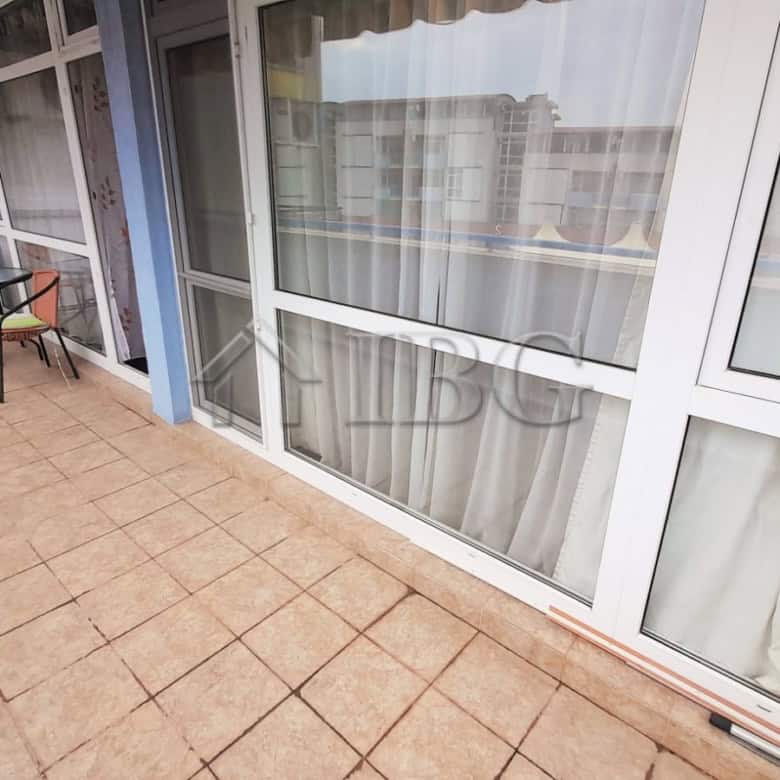 Bright balcony with pool view in Sunny Beach, Cacao Beach.