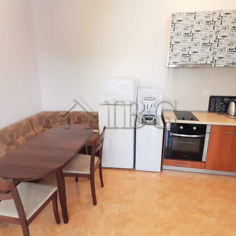 Cozy 1-bedroom apartment with pool view, kitchen, and dining area in Sunny Beach, Cacao Beach.