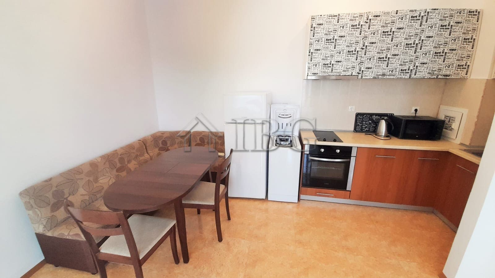 Cozy 1-bedroom apartment with pool view, kitchen, and dining area in Sunny Beach, Cacao Beach.