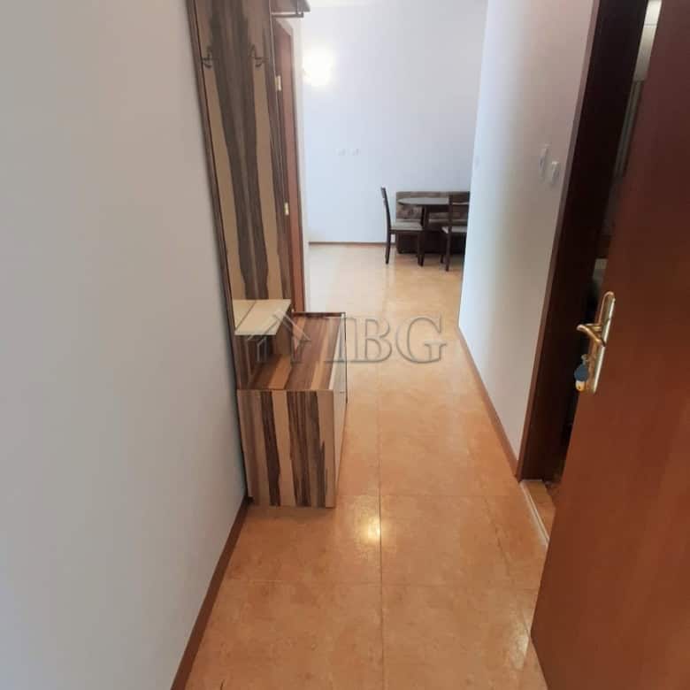 Bright hallway leading to living area with pool view in Sunny Beach, Cacao Beach.