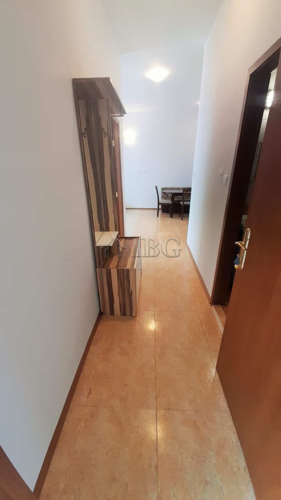 Bright hallway leading to living area with pool view in Sunny Beach, Cacao Beach.