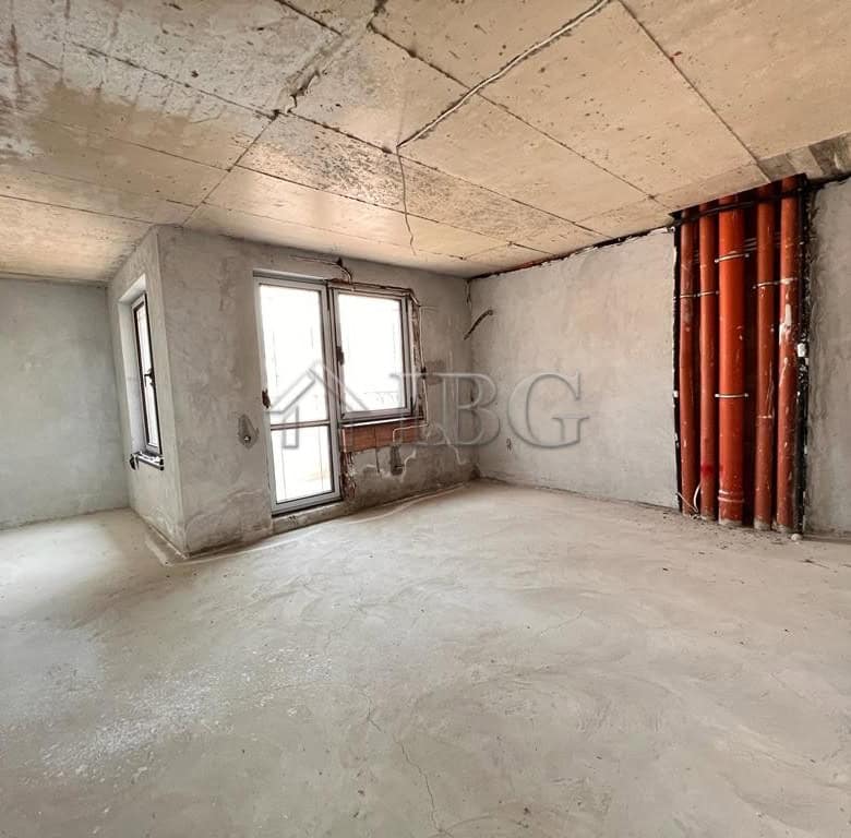 Unfinished apartment interior with large windows and exposed pipes in Sveti Vlas.