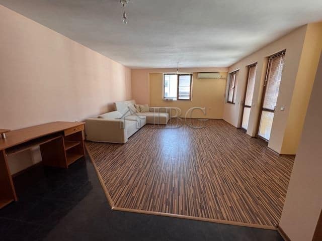 Bright living room with large windows and wooden flooring in Vazrazhdane district, Burgas.