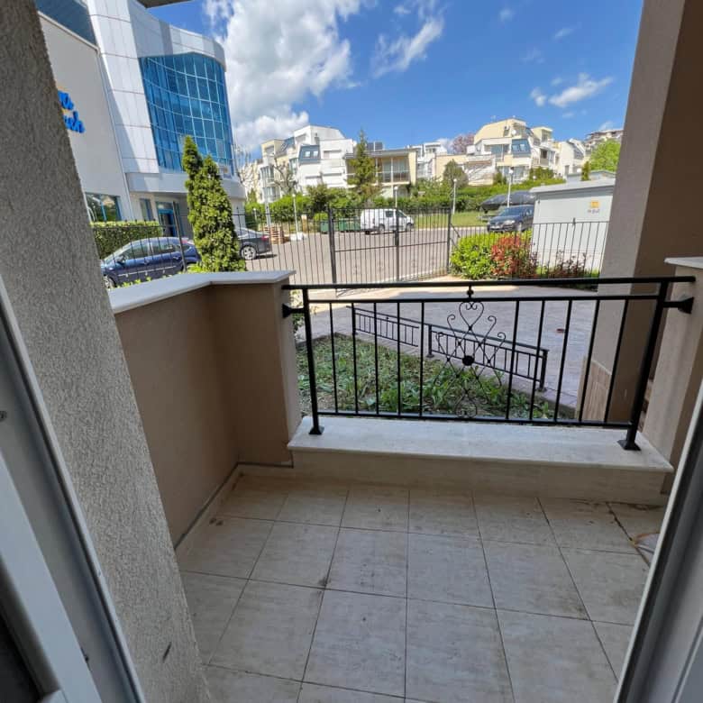 Balcony view of Ipanema Beach complex in Saint Vlas, Bulgaria, with modern buildings and lush greene.