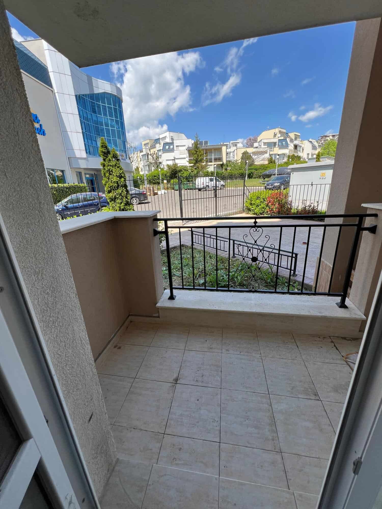 Balcony view of Ipanema Beach complex in Saint Vlas, Bulgaria, with modern buildings and lush greene.