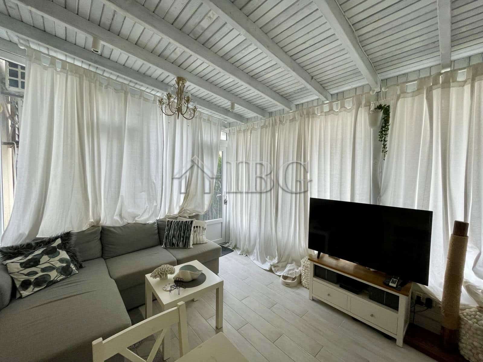 Bright living room with white curtains and modern furniture in Sun Gate, Sunny Beach.