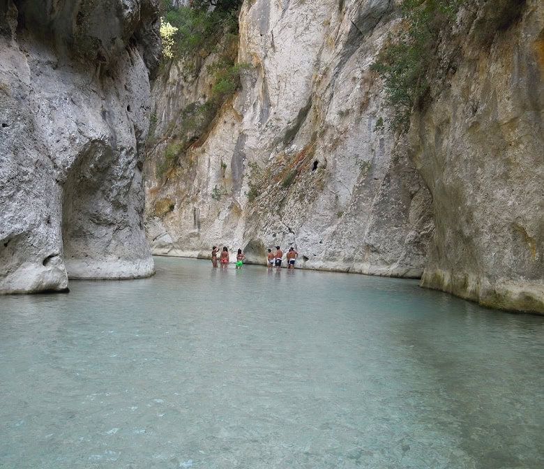 Plot of land for sale in Vitsa Zagori Greece with scenic river views and natural surroundings.