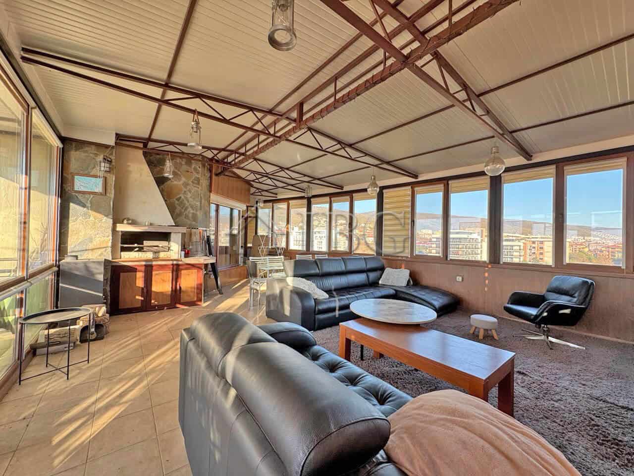 Bright living room with large windows and modern furniture in Sveti Vlas.
