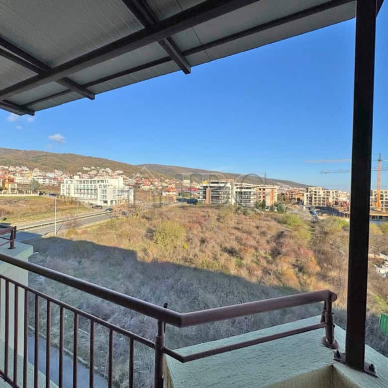 Bright balcony view of Sveti Vlas with city and mountain scenery.