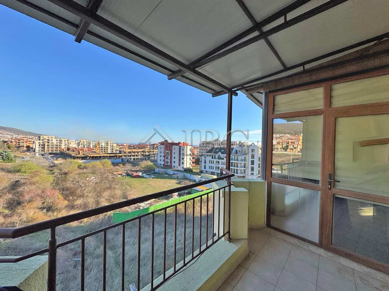Bright balcony view of Sveti Vlas with cityscape and greenery. Perfect for relaxing and enjoying out.