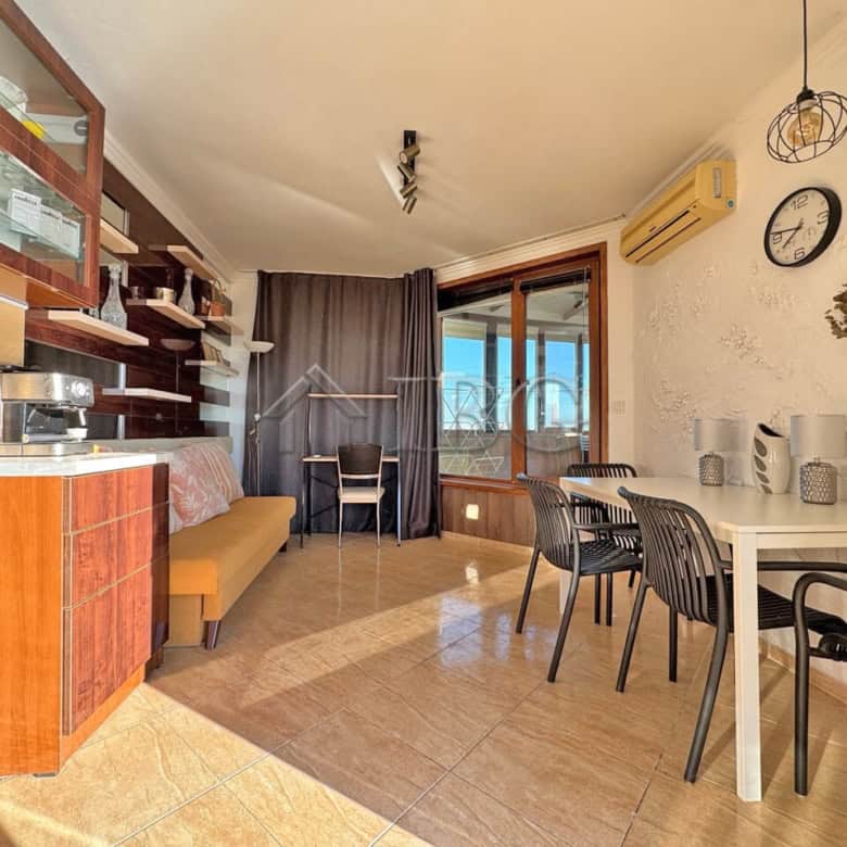 Spacious 1-bedroom apartment featuring a large terrace, modern furnishings, and scenic views in Anto.