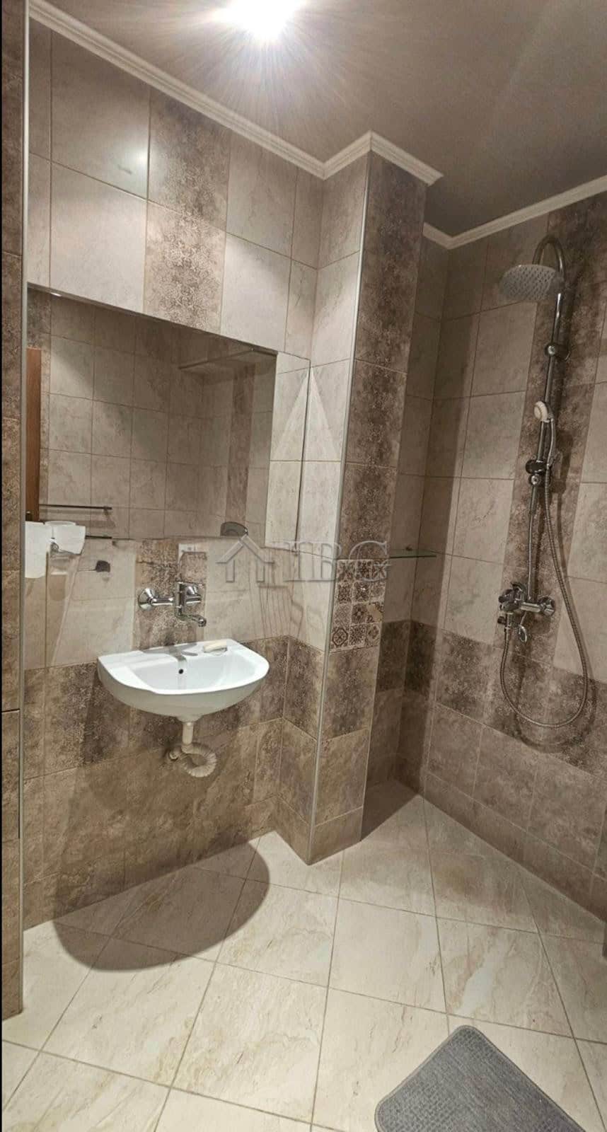 Bright bathroom with modern fixtures in a central Ruse apartment.