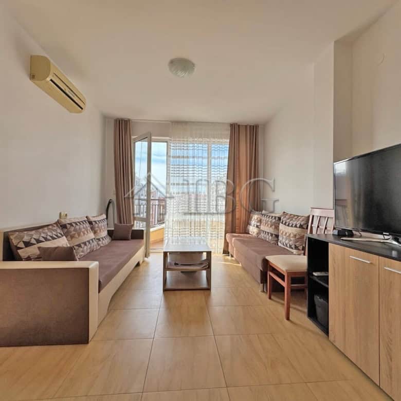 Spacious living room in Aqua Dreams apartment with modern furniture and balcony views in Sveti Vlas.
