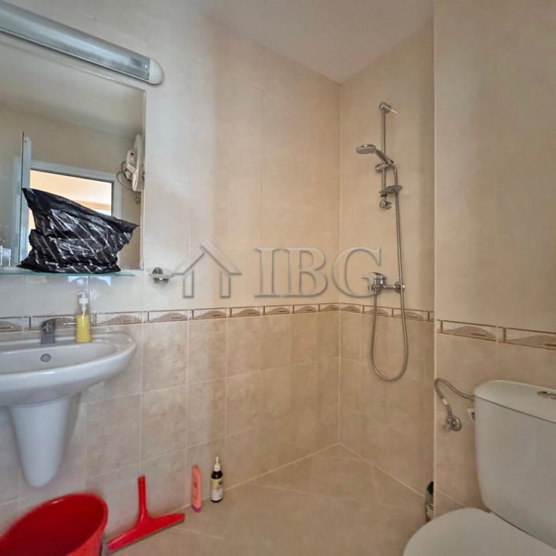 Bathroom in Aqua Dreams apartment with shower, toilet, and sink in Sveti Vlas.