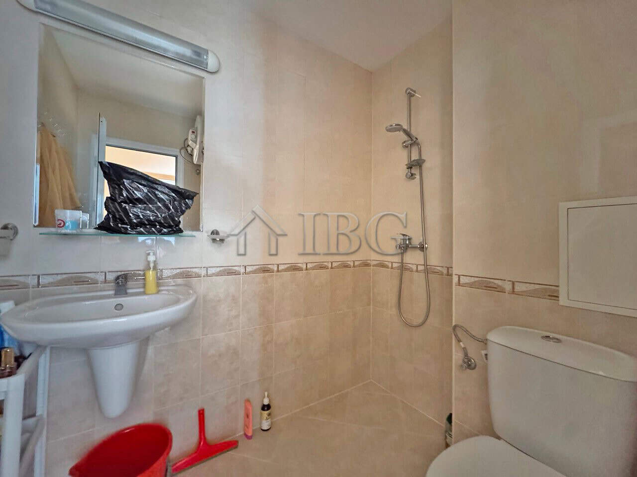 Bathroom in Aqua Dreams apartment with shower, toilet, and sink in Sveti Vlas.