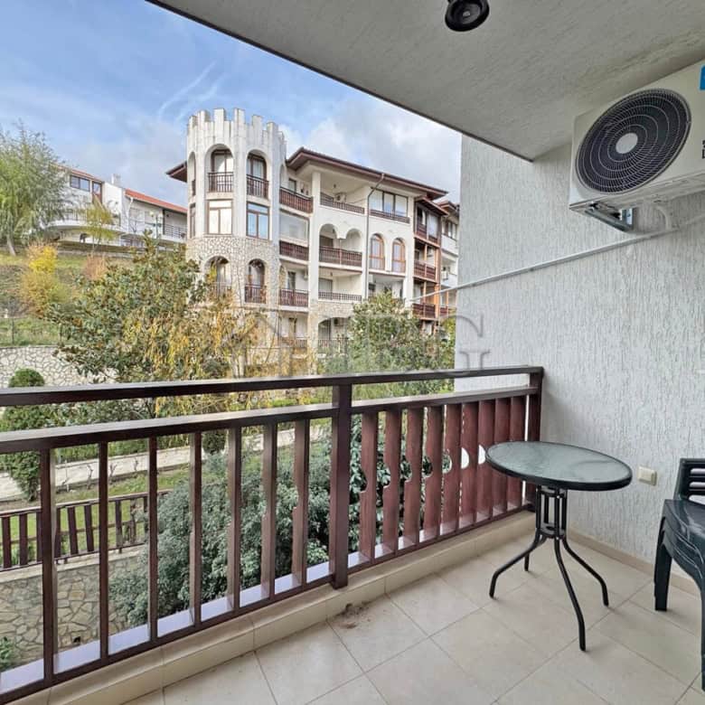 Bright balcony view of residential buildings and greenery in Sveti Vlas.