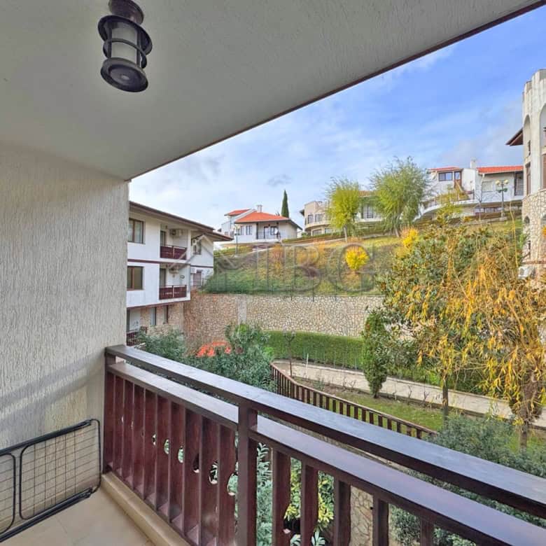 Bright balcony view of the garden and surrounding buildings in Sveti Vlas.