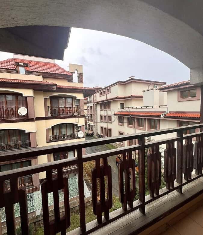 Balcony view of residential buildings in Sveti Vlas, Bulgaria, with a glimpse of the sea in the back.