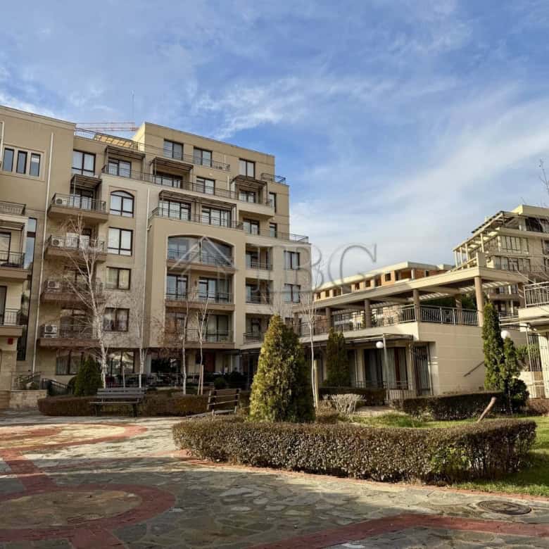 Apartment building with balconies and landscaped garden in Sveti Vlas.