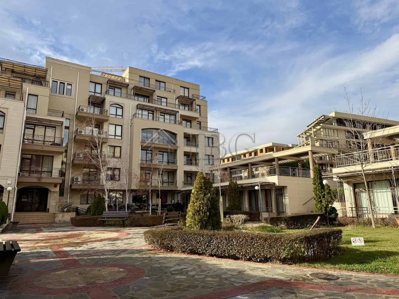 Apartment building with balconies and landscaped garden in Sveti Vlas.