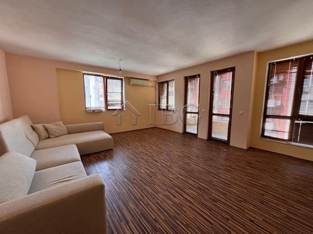 Bright living room with large windows and wooden flooring in Vazrazhdane district, Burgas.