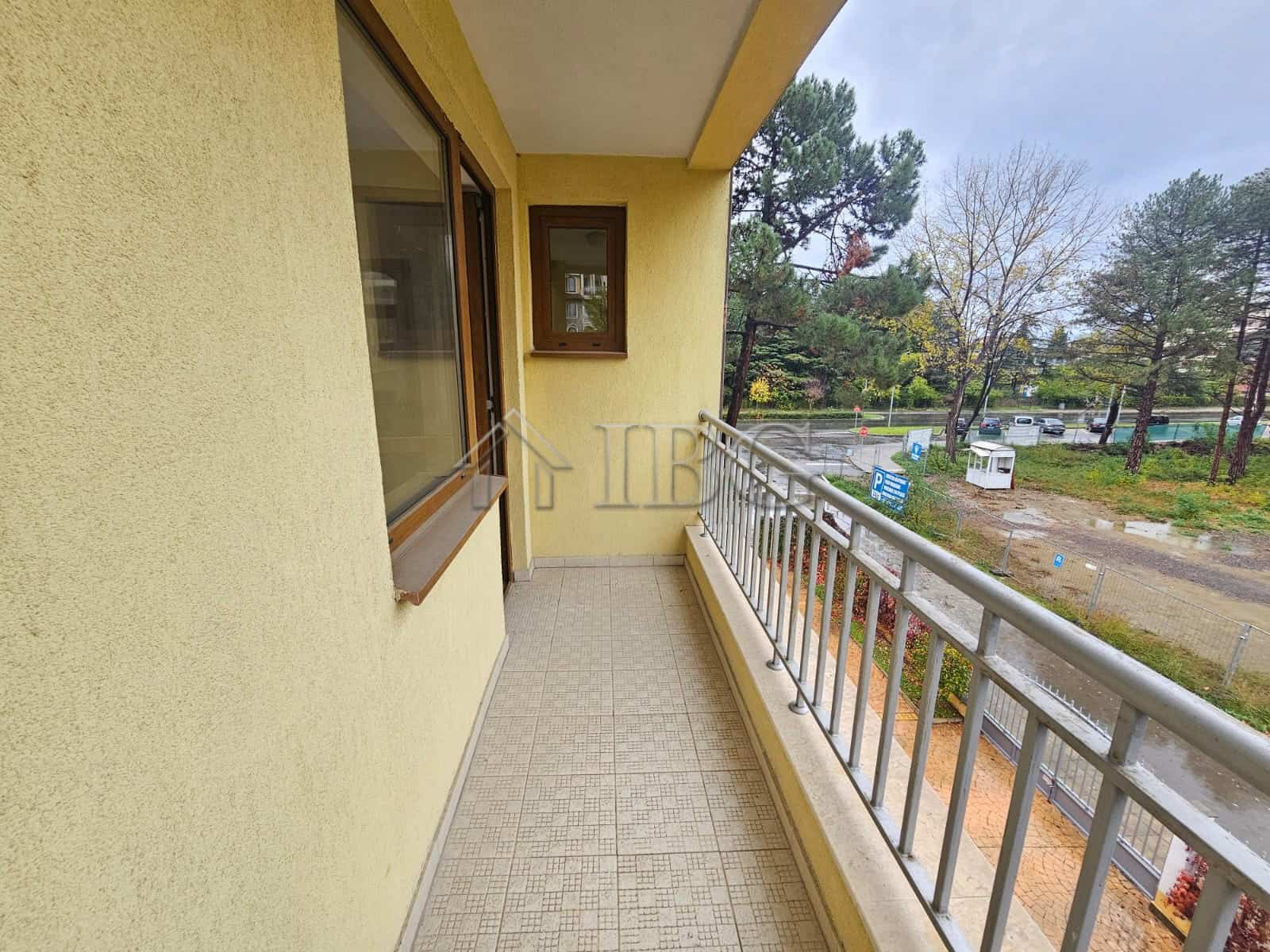 Apartment balcony overlooking pool and garden in Sunny Beach.