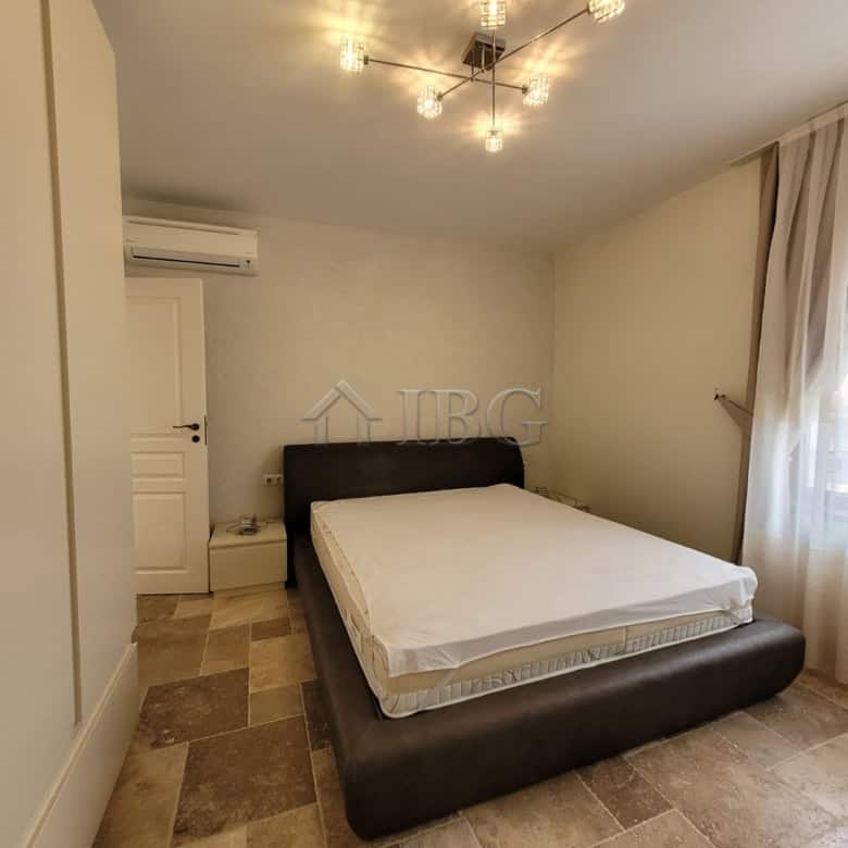 Elegant bedroom in a three-level maisonette overlooking the sea in Sveti Vlas. Modern decor with sty.