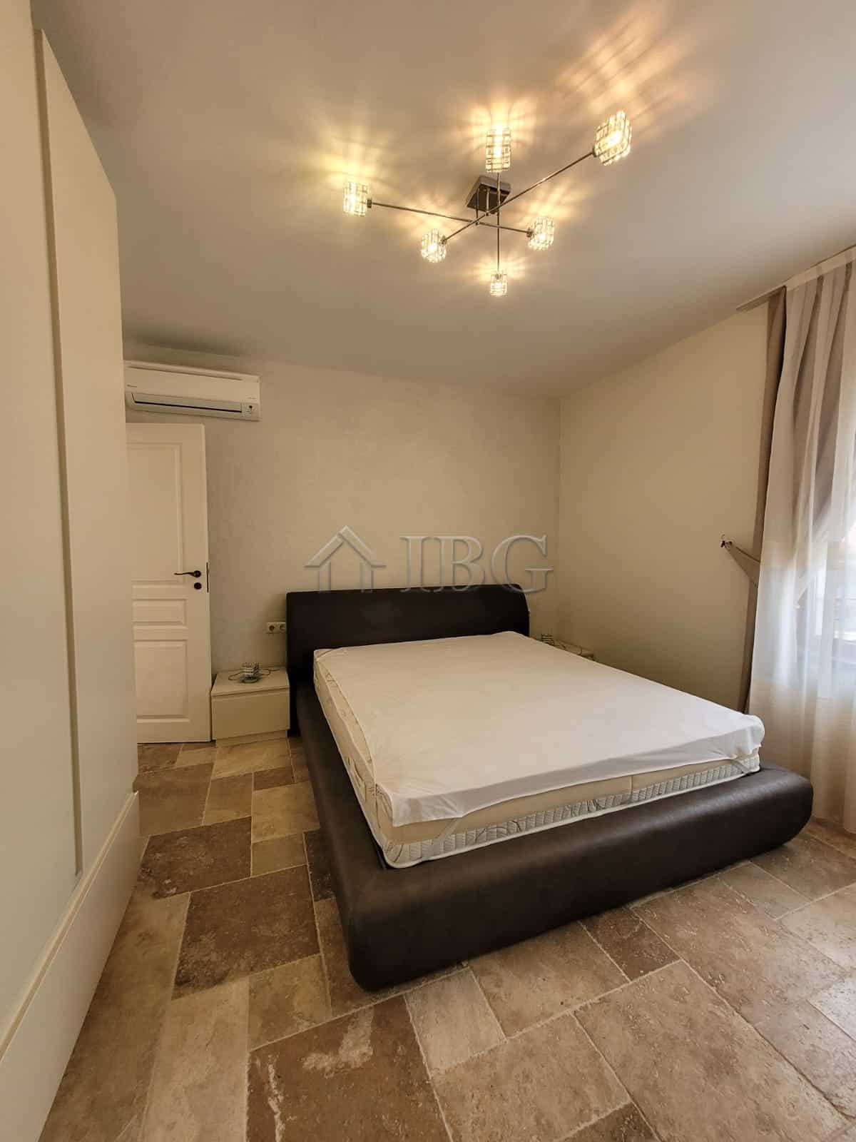 Elegant bedroom in a three-level maisonette overlooking the sea in Sveti Vlas. Modern decor with sty.