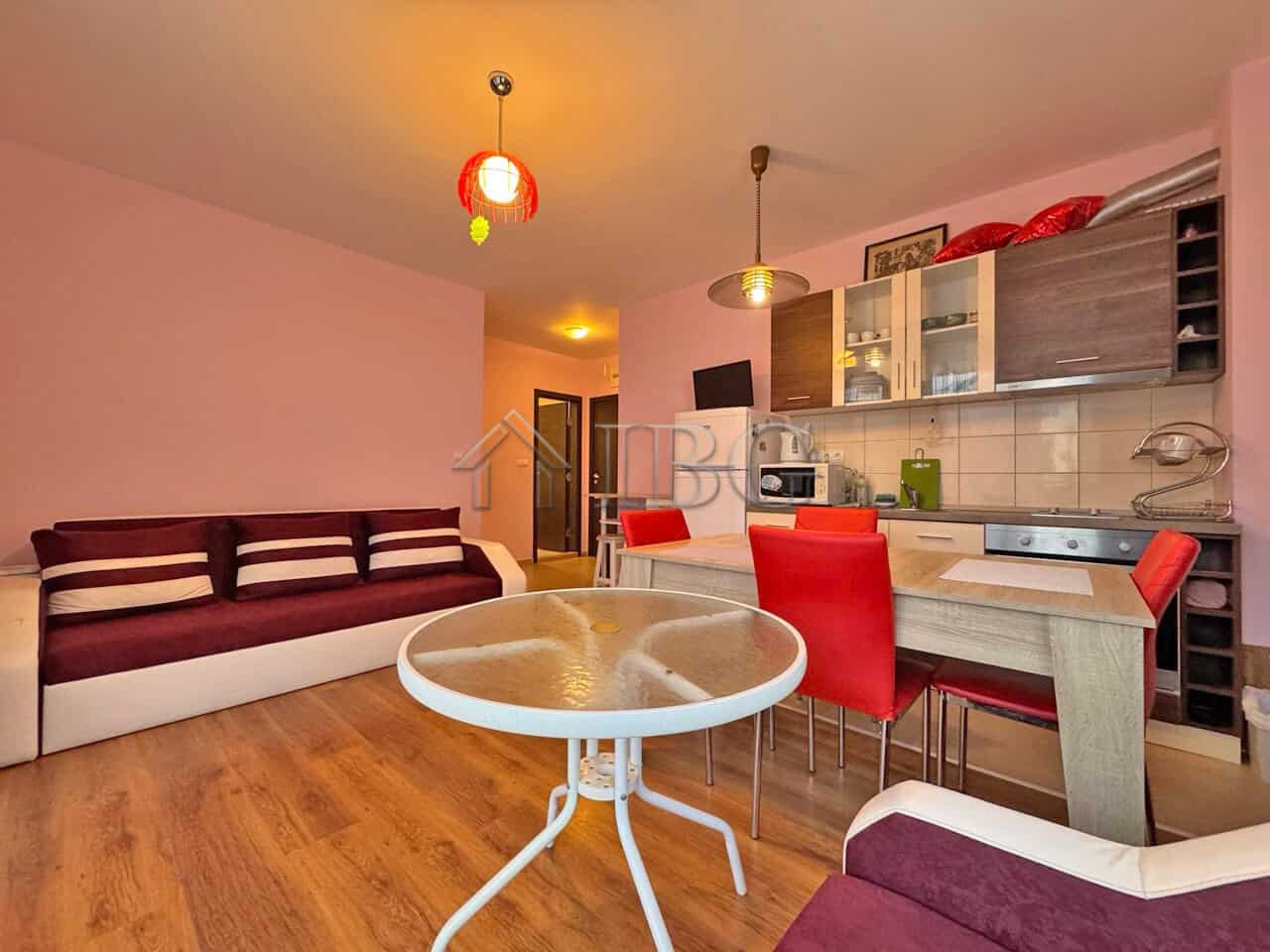 Apartment with pool view in Sunny Beach, Bulgaria, featuring a modern living area and open kitchen.