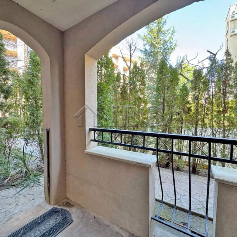 Balcony overlooking trees at Cascadas Family Resort, Sunny Beach, Bulgaria, offering a peaceful outd.
