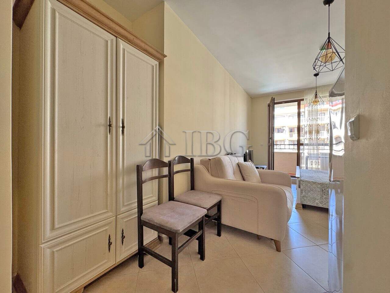 Bright living room with sofa and chairs at Cascadas Family Resort, Sunny Beach.