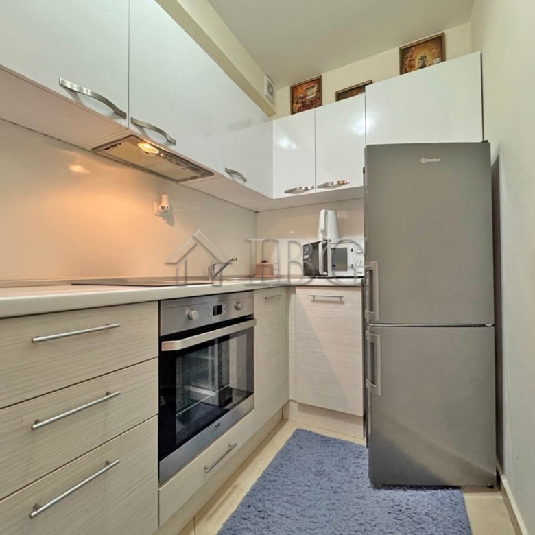 Bright kitchen with modern appliances in Cascadas Family Resort, Sunny Beach.