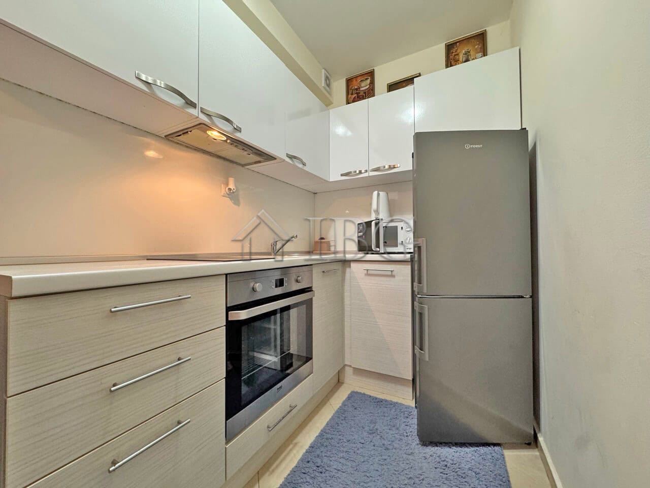 Bright kitchen with modern appliances in Cascadas Family Resort, Sunny Beach.