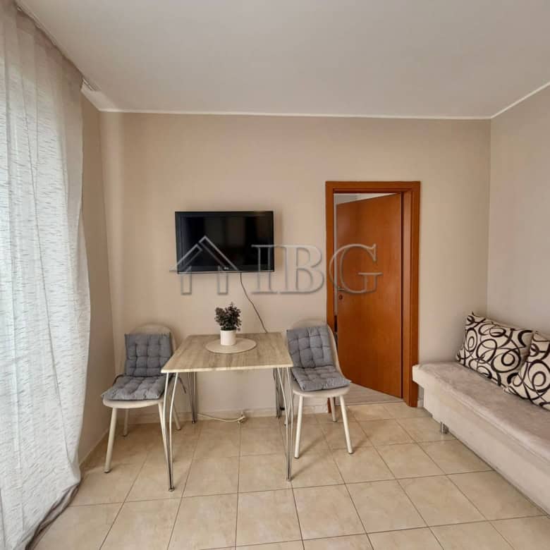 Bright 1-bedroom apartment with living area and seating in Sunny Beach, Bulgaria.