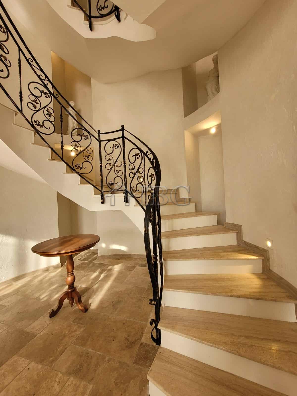 Elegant interior of a three-level maisonette with a spiral staircase and sea views in Sveti Vlas.
