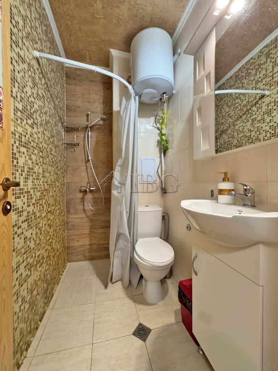 Compact studio bathroom with shower and modern fixtures in Diamond Bay, Sunny Beach.