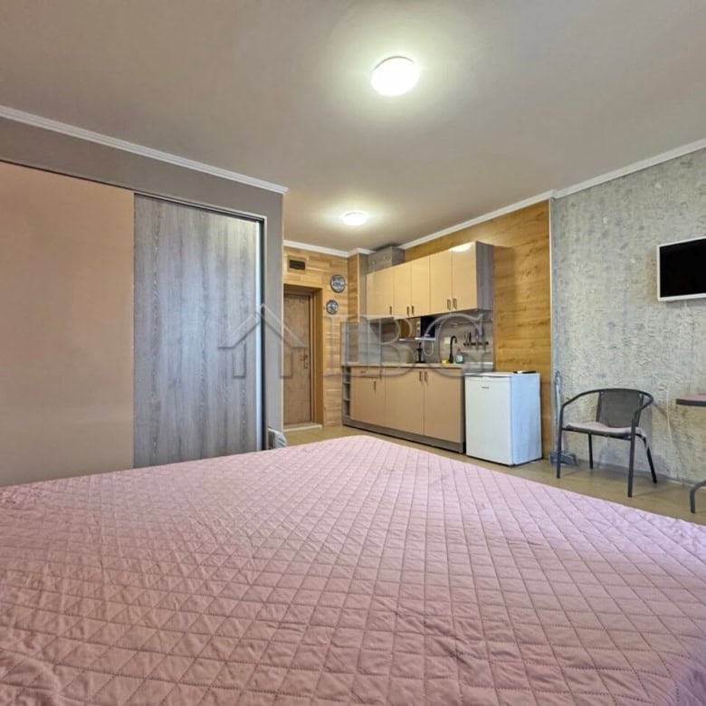 Apartment interior with kitchenette and living area in Diamond Bay, Sunny Beach.