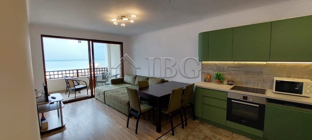 Bright apartment featuring a spacious living area, modern kitchen, and large balcony overlooking the.