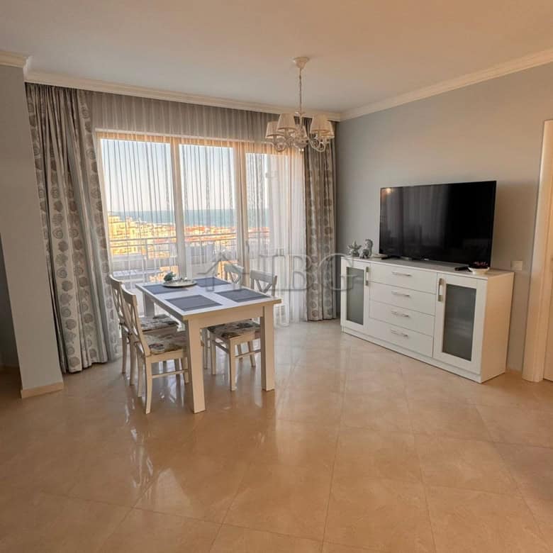 Bright living room with sea and mountain views in Sveti Vlas apartment.