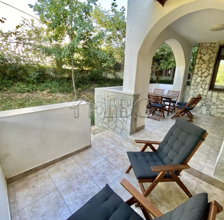 Exterior view of a spacious apartment terrace with seating in Sveti Vlas, Bulgaria.