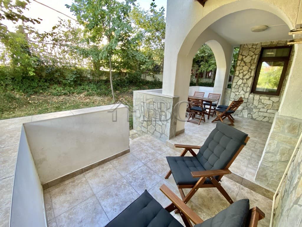 Exterior view of a spacious apartment terrace with seating in Sveti Vlas, Bulgaria.