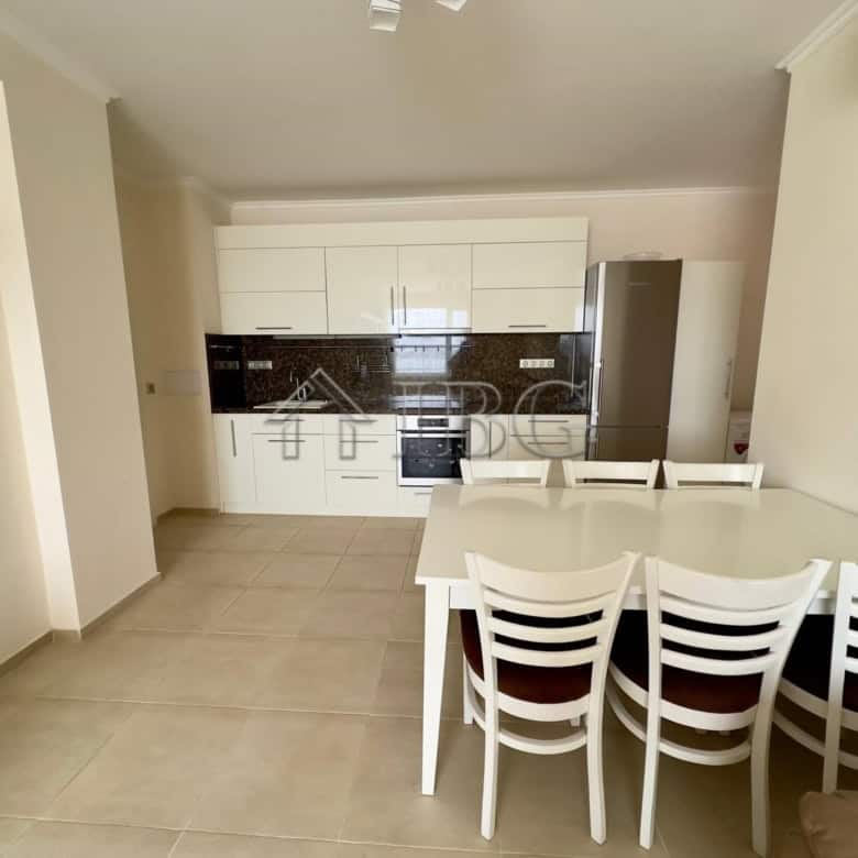 Modern kitchen and dining space with front sea view in a luxury apartment at Akrotiria Beach, Nesseb.
