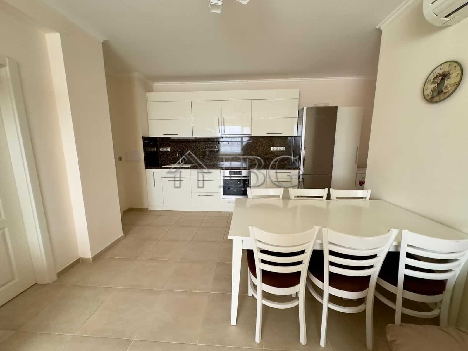 Modern kitchen and dining space with front sea view in a luxury apartment at Akrotiria Beach, Nesseb.