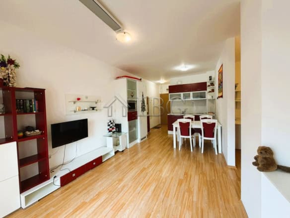 Bright 2-bedroom apartment overlooking park and tennis courts, sunny day, modern furnishings, ideal.