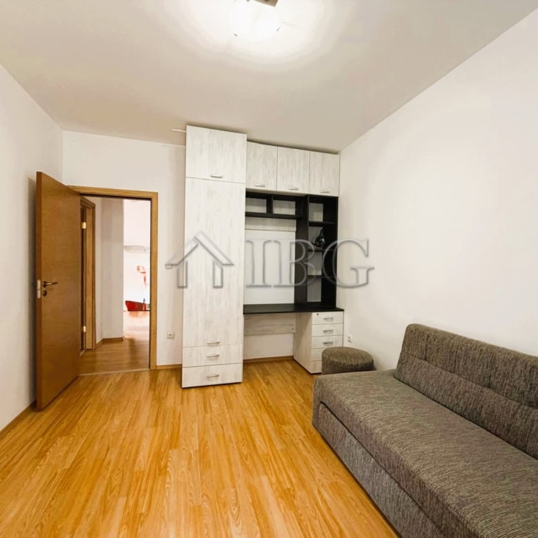 Modern 2-bedroom apartment with park and tennis court views, sunny day at Sunny Beach.