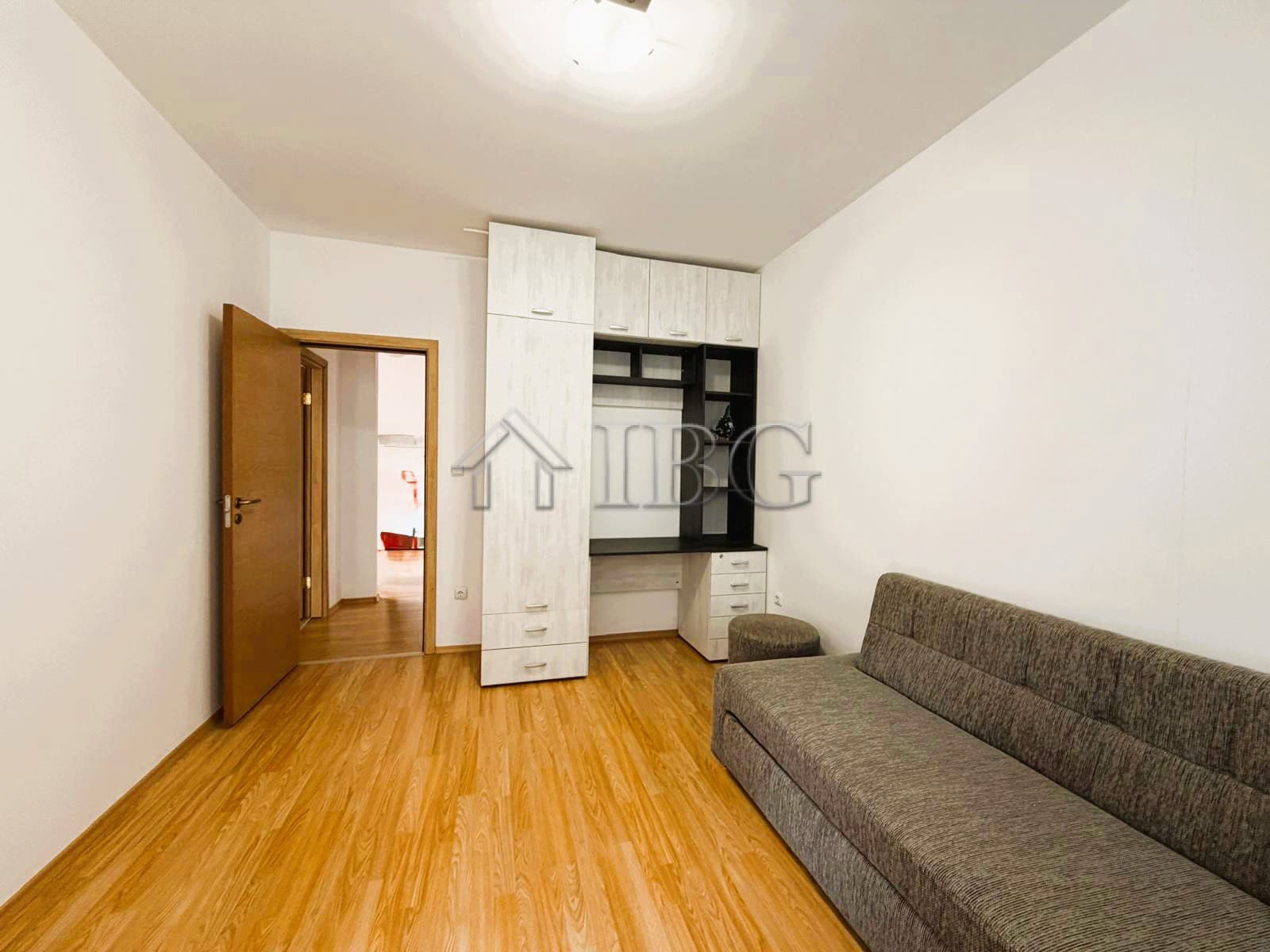Modern 2-bedroom apartment with park and tennis court views, sunny day at Sunny Beach.