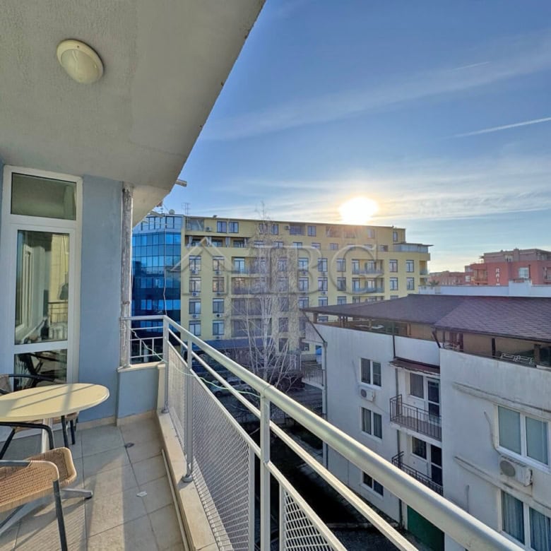Bright balcony view of Sunny Beach cityscape with modern buildings and clear sky.